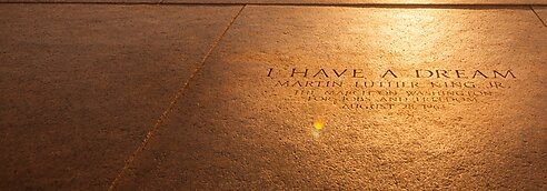 A portrait of the Washington Monument and a memorial "I have a Dream" marker