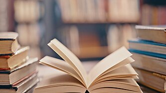 Open books on a library table