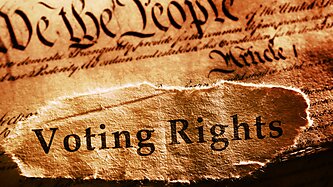 The US Constitution with "Voting Rights" written on paper